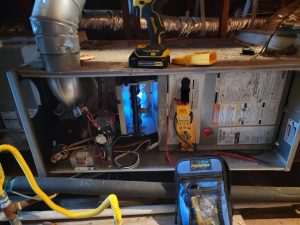 Heating Repair Service in Houston, checking heating elements in attic
