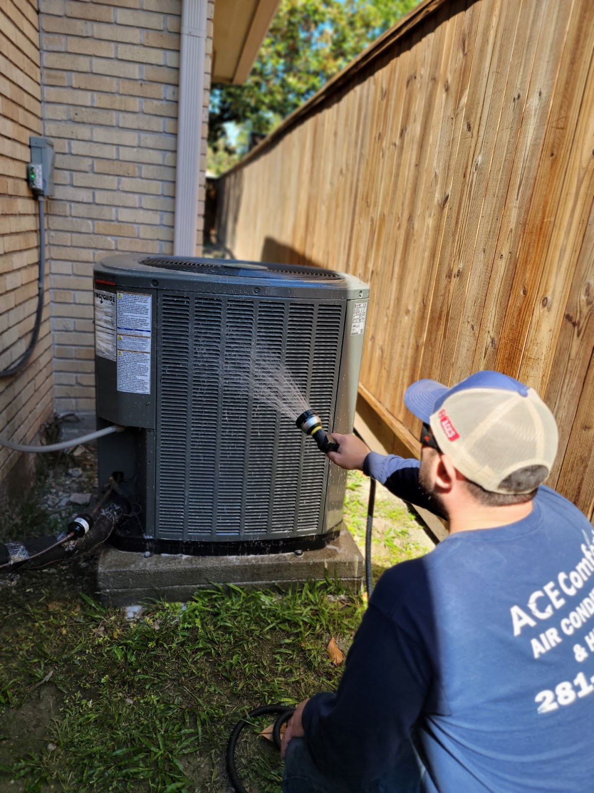 Hosing Off Outdoor Air Conditioner during yearly Ac Maintenance Near Me