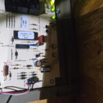 ACE Comfort technician fixing a zone control system in a Rice Military home, keeping the Oliver family cool and happy