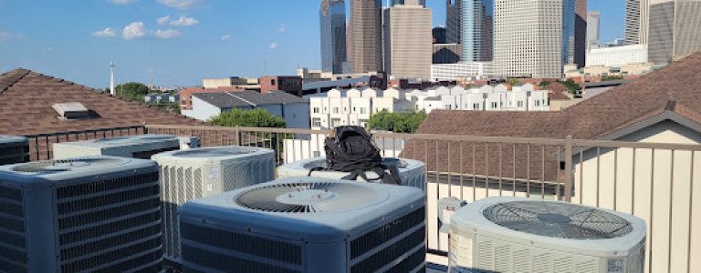 commercial ac units during our ac repair houston tx service overlooking downtown houston buildings